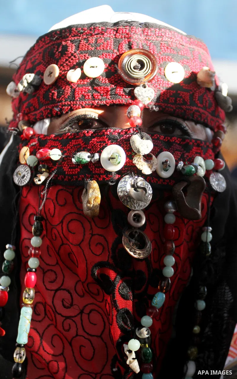 Palestinians take part in heritage festival during the closing ceremony of 2016 summer fun week organised by the United Nations Relief and Works Agency (UNRWA), in Khan Younis in the southern Gaza strip, on August 17, 20...