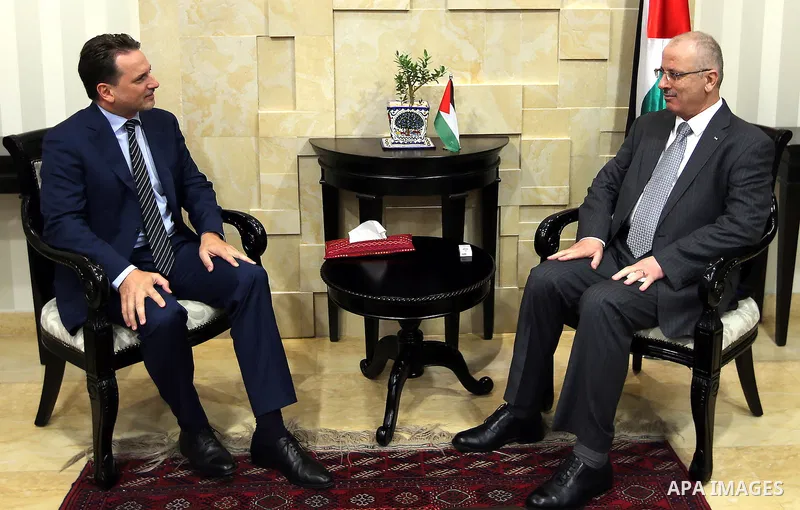 Palestinian Prime Minister, Rami Hamadallah, meets with Commissioner-General of UNRWA Krenpol Pierre, the director of UNRWA operations in the West Bank Scott Anderson, in the West Bank city of Ramallah on Aug 18, 2016. P...