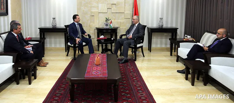 Palestinian Prime Minister, Rami Hamadallah, meets with Commissioner-General of UNRWA Krenpol Pierre, the director of UNRWA operations in the West Bank Scott Anderson, in the West Bank city of Ramallah on Aug 18, 2016. P...