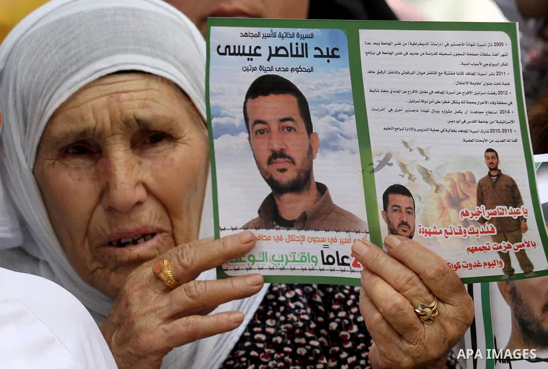 Palestinians take part in a protest demanding release the prisoners in Israeli jails, in the West Bank city of Nablus on August 18, 2016. Photo by Nedal Eshtayah