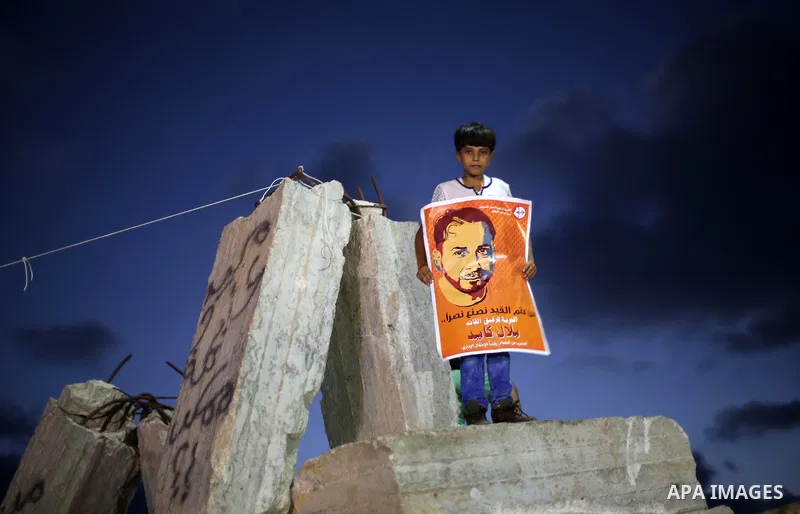 Palestinian children take part in a protest to show solidarity with Palestinian prisoner Bilal Kayed, who has been fasting for almost two months over his detention without trial, in Gaza seaport, on August 18, 2016. Kaye...