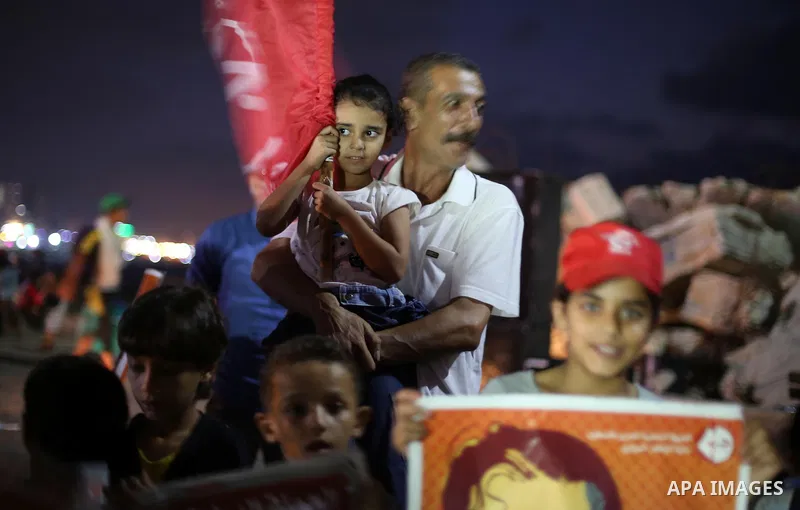 Palestinian children take part in a protest to show solidarity with Palestinian prisoner Bilal Kayed, who has been fasting for almost two months over his detention without trial, in Gaza seaport, on August 18, 2016. Kaye...