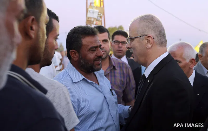 Palestininan Prime Minister, Rami Hamdallah, attends the funeral of the martyr Mohammed Abu Hashash and Naim Ahawamrh, in the West bank city of Ramallah on August 19, 2016. Photo by Prime Minister Office