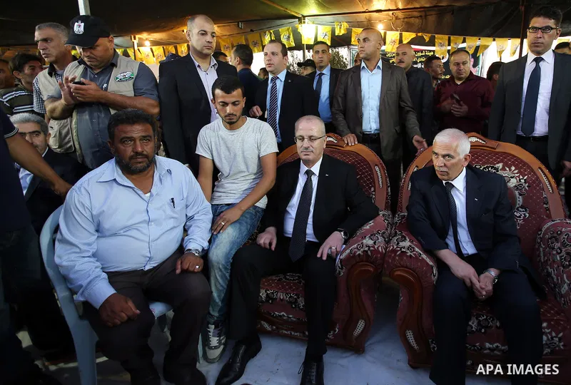 Palestininan Prime Minister, Rami Hamdallah, attends the funeral of the martyr Mohammed Abu Hashash and Naim Ahawamrh, in the West bank city of Ramallah on August 19, 2016. Photo by Prime Minister Office