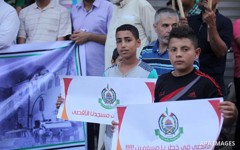 Palestinians take part during a protest to mark the 47th anniversary of the burning of Al-Aqsa Mosque, in Gaza city on Aug. 21, 2016. Photo by Ashraf Amra