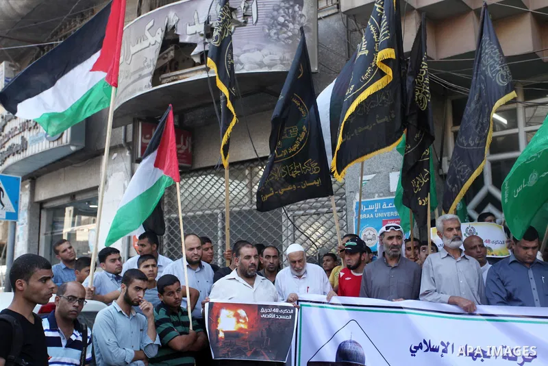 Palestinians take part during a protest to mark the 47th anniversary of the burning of Al-Aqsa Mosque, in Gaza city on Aug. 21, 2016. Photo by Ashraf Amra