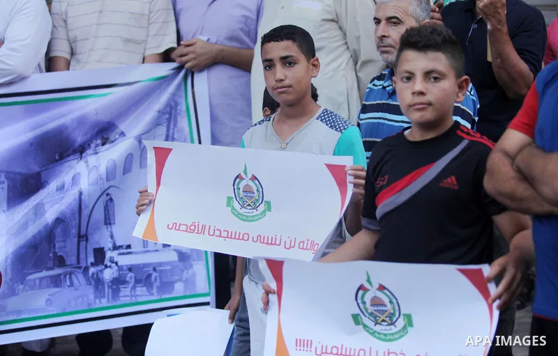 Palestinians take part during a protest to mark the 47th anniversary of the burning of Al-Aqsa Mosque, in Gaza city on Aug. 21, 2016. Photo by Ashraf Amra