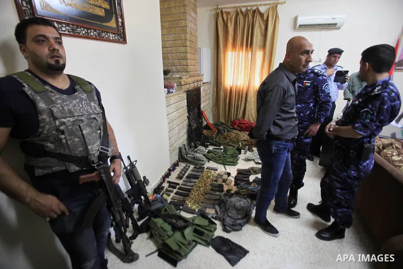 Members of Palestinian security forces inspects weapons and several hand grenades for Palestinian gunmen during operation search in the old city in the west bank city of Nablus August 21, 2016. Palestinian security force...