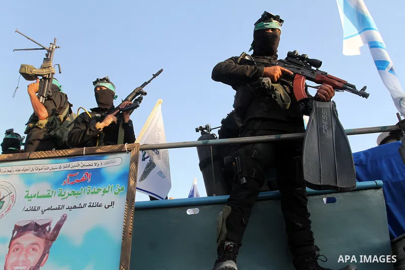 Palestinian members of the marine unit of al-Qassam Brigades, the armed wing of the Hamas movement, hold their weapon during an anti-Israel military parade, in Rafah in the southern Gaza Strip August 21, 2016. Photo by A...