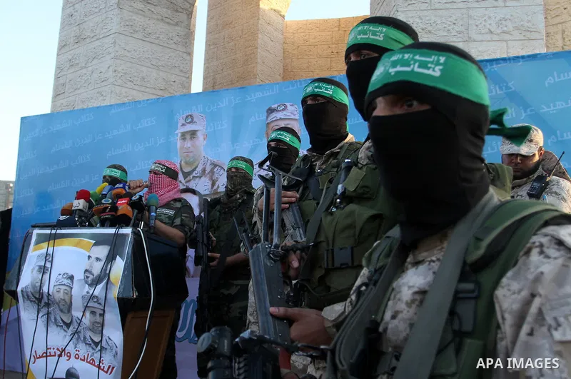 Spokesman of al-Qassam Brigades, the military wing of Hamas movement, Abu Obeida speaks during an anti-Israel military parade staged by members of al-Qassam Brigades, the armed wing of the Hamas movement, in Rafah in the...