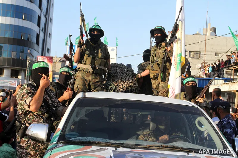 Palestinian members of al-Qassam Brigades, the armed wing of the Hamas movement, take part during an anti-Israel military parade, in Rafah in the southern Gaza Strip August 21, 2016. Photo by Abed Rahim Khatib