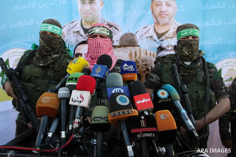 Spokesman of al-Qassam Brigades, the military wing of Hamas movement, Abu Obeida speaks during an anti-Israel military parade staged by members of al-Qassam Brigades, the armed wing of the Hamas movement, in Rafah in the...