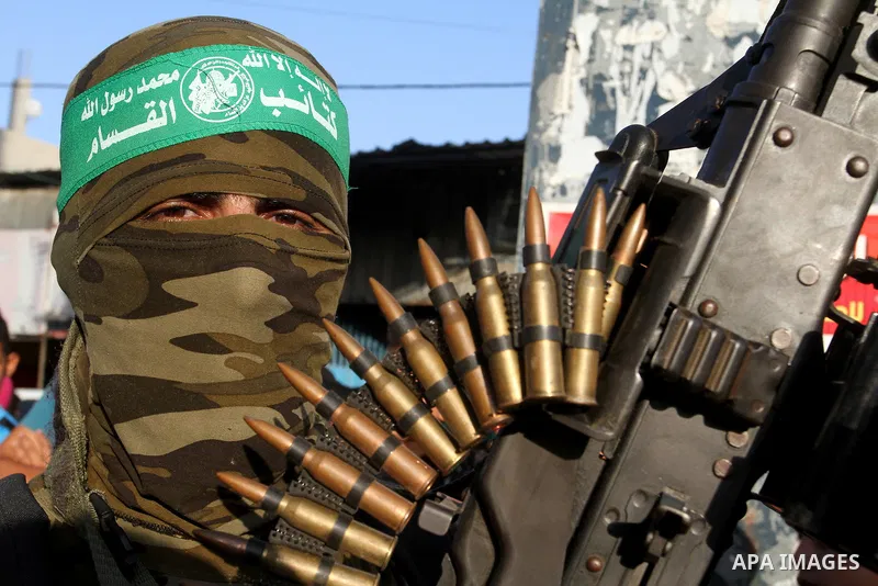 Palestinian members of al-Qassam Brigades, the armed wing of the Hamas movement, take part during an anti-Israel military parade, in Rafah in the southern Gaza Strip August 21, 2016. Photo by Abed Rahim Khatib