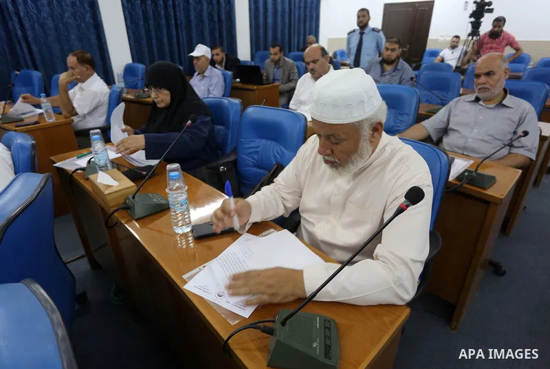 Members of the Palestinian legislative council from Hamas movement attend a meeting at the legislative council in Gaza city, on August 22, 2016. Photo by Mohammed Asad