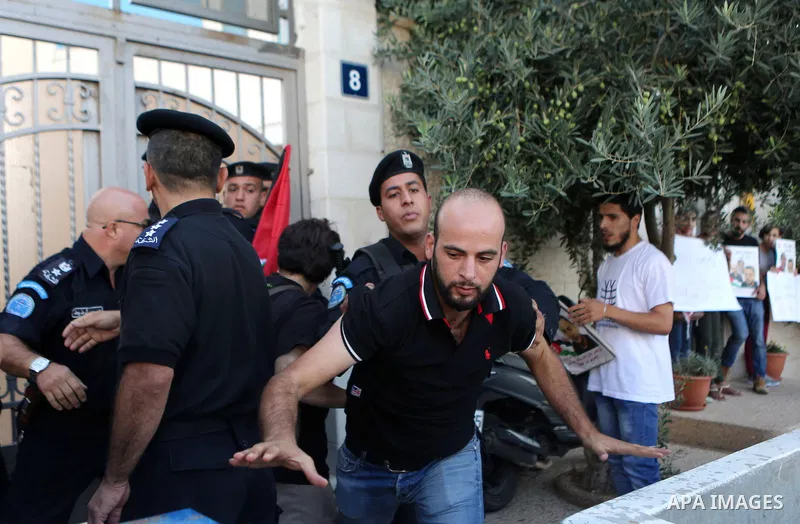A Palestinian Protesters Argues with Palestinian security during a protest against administrative detention and in support of Palestinian prisoner Bilal Kayed ,who has been fasting for almost two months over his detentio...