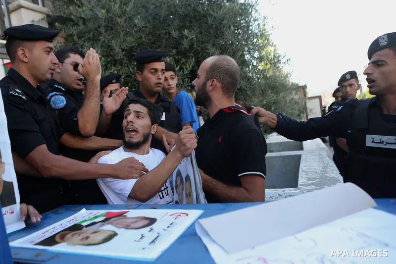 A Palestinian Protesters Argues with Palestinian security during a protest against administrative detention and in support of Palestinian prisoner Bilal Kayed ,who has been fasting for almost two months over his detentio...