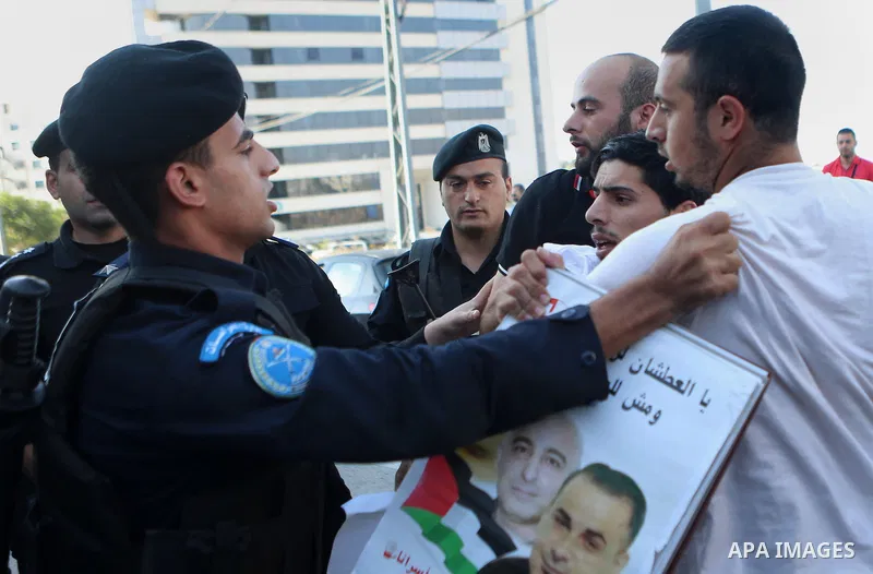 A Palestinian Protesters Argues with Palestinian security during a protest against administrative detention and in support of Palestinian prisoner Bilal Kayed ,who has been fasting for almost two months over his detentio...