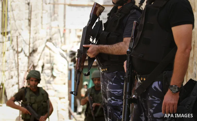 Members of the Palestinian security forces patrol in the West Bank city of Nablus on August 22, 2016 during ongoing clashes between the security forces and Palestinian gunmen. Palestinian security forces detained two Nab...