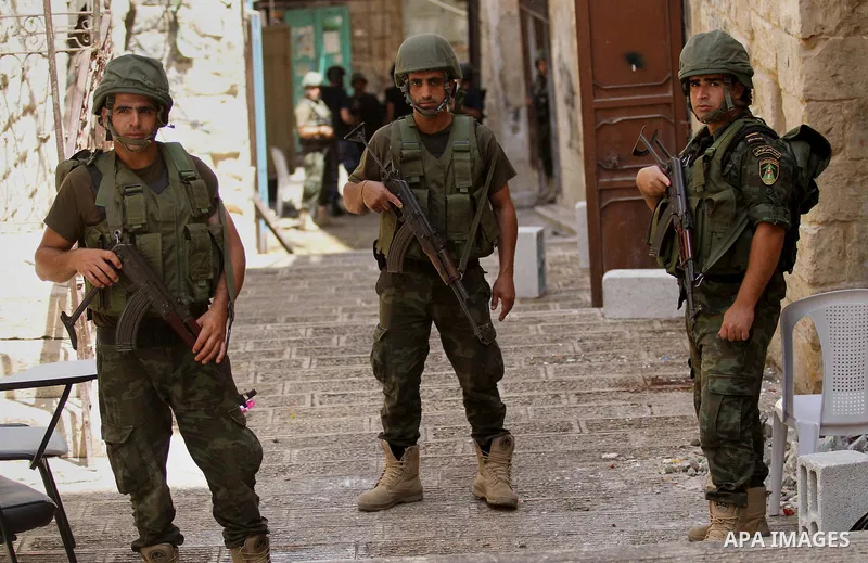 Members of the Palestinian security forces patrol in the West Bank city of Nablus on August 22, 2016 during ongoing clashes between the security forces and Palestinian gunmen. Palestinian security forces detained two Nab...