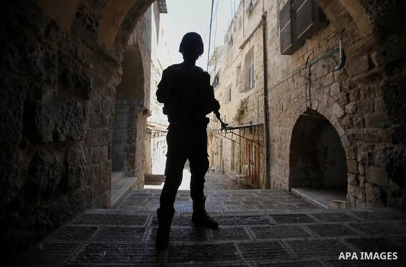 Members of the Palestinian security forces patrol in the West Bank city of Nablus on August 22, 2016 during ongoing clashes between the security forces and Palestinian gunmen. Palestinian security forces detained two Nab...