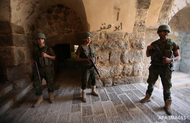 Members of the Palestinian security forces patrol in the West Bank city of Nablus on August 22, 2016 during ongoing clashes between the security forces and Palestinian gunmen. Palestinian security forces detained two Nab...