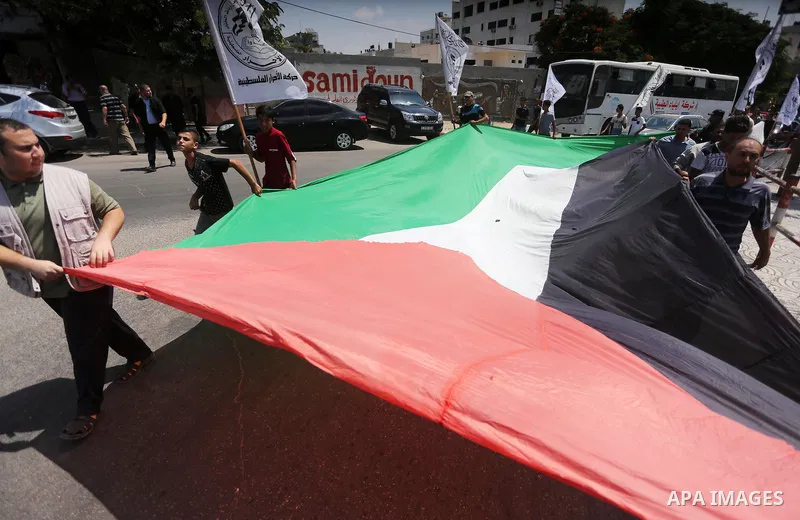 Palestinians take part during a protest to mark the 47th anniversary of the burning of Al-Aqsa Mosque, in Gaza city on Aug. 23, 2016. Photo by Mohammed Asad