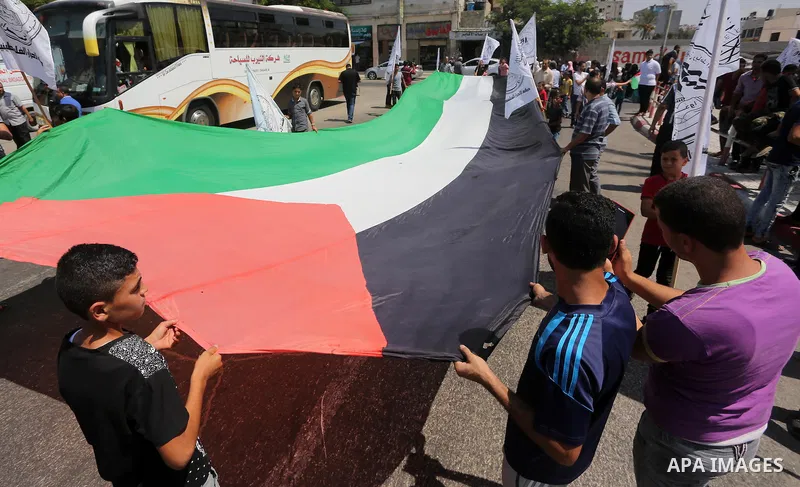 Palestinians take part during a protest to mark the 47th anniversary of the burning of Al-Aqsa Mosque, in Gaza city on Aug. 23, 2016. Photo by Mohammed Asad