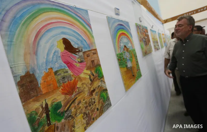 Director of UNRWA operations in Gaza Bo Shack attends the art exhibition "draw your dream for Gaza 2020", in Gaza city on Aug. 23, 2016. Photo by Mohammed Asad