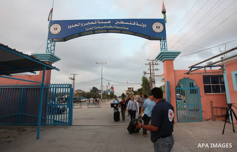 Members of the international animal welfare charity "Four Paws" transport animals across the Erez border crossing into Israel after evacuating them from the zoo in Khan Yunis in the southern Gaza Strip on August 24, 2016...