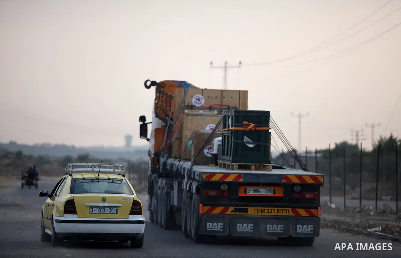 Members of the international animal welfare charity "Four Paws" transport animals across the Erez border crossing into Israel after evacuating them from the zoo in Khan Yunis in the southern Gaza Strip on August 24, 2016...