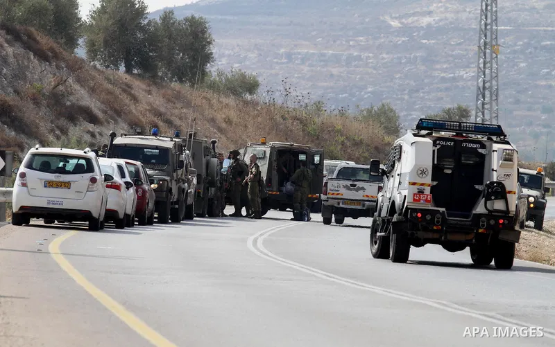 Israeli security forces gather at the scene where Palestinian Sari Abu Ghrab was shot dead by Israeli troops near the West Bank village of Madama near Nablus August 24, 2016. An Israeli army statement said Israeli forces...
