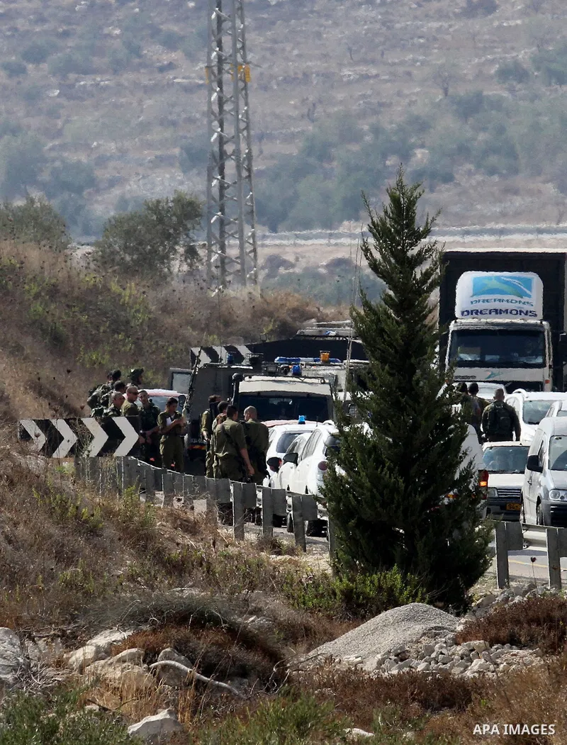 Israeli security forces gather at the scene where Palestinian Sari Abu Ghrab was shot dead by Israeli troops near the West Bank village of Madama near Nablus August 24, 2016. An Israeli army statement said Israeli forces...