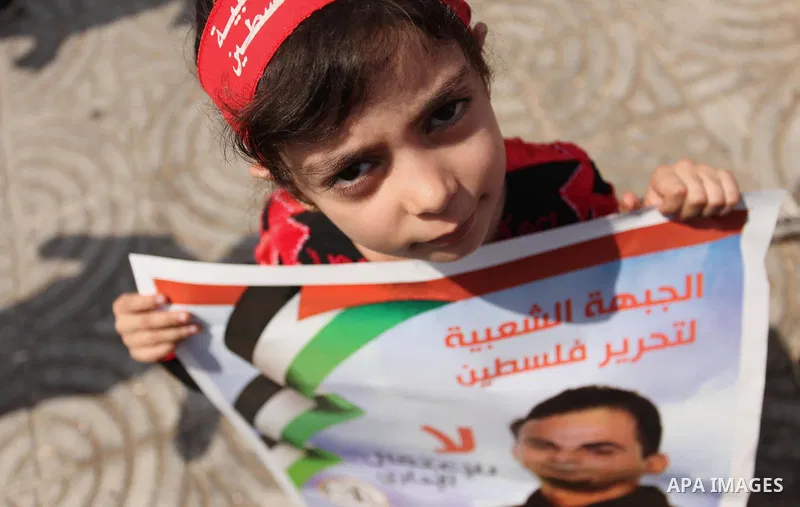 Supporters of the Popular Front for the Liberation of Palestine (PFLP) take part in a celebration of Bilal Kayed, in Gaza city on August 25, 2016. Palestinian prisoner Bilal Kayid has suspended his hunger strike after sp...
