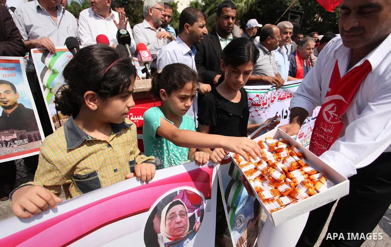 Supporters of the Popular Front for the Liberation of Palestine (PFLP) take part in a celebration of Bilal Kayed, in Gaza city on August 25, 2016. Palestinian prisoner Bilal Kayid has suspended his hunger strike after sp...