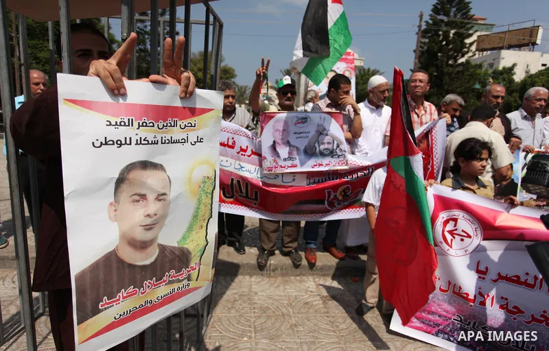 Supporters of the Popular Front for the Liberation of Palestine (PFLP) take part in a celebration of Bilal Kayed, in Gaza city on August 25, 2016. Palestinian prisoner Bilal Kayid has suspended his hunger strike after sp...