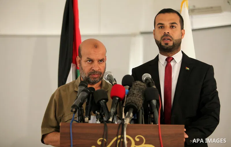 Palestinian undersecretary of the Interior Ministry, Kamel Abu Madi, and Eyad al-Bozm, the spokesman of the Palestinian Ministry of the Interior, speak during a press conference on the Central Election Commission, in Gaz...