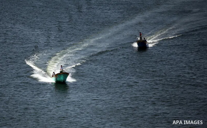 Palestinian fishermen ride their fishing boats at Gaza's seaport of Gaza City, on Aug. 25, 2016. Israeli naval forces wound Palestinian fisherman after opening fire on boats in the northern Gaza Strip. Photo by Ashraf Am...