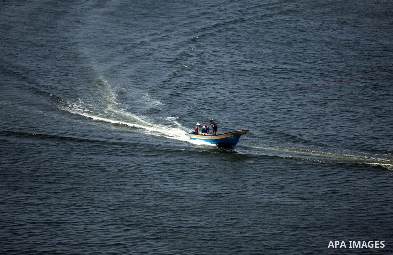 Palestinian fishermen ride their fishing boats at Gaza's seaport of Gaza City, on Aug. 25, 2016. Israeli naval forces wound Palestinian fisherman after opening fire on boats in the northern Gaza Strip. Photo by Ashraf Am...