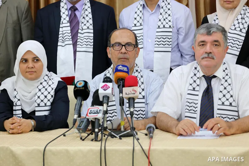 Palestinian members of Gaza Hashim, an electoral list for the upcoming Gaza municipality polls, hold a press conference in Gaza city, on Aug. 25, 2016. Photo by Mohammed Asad