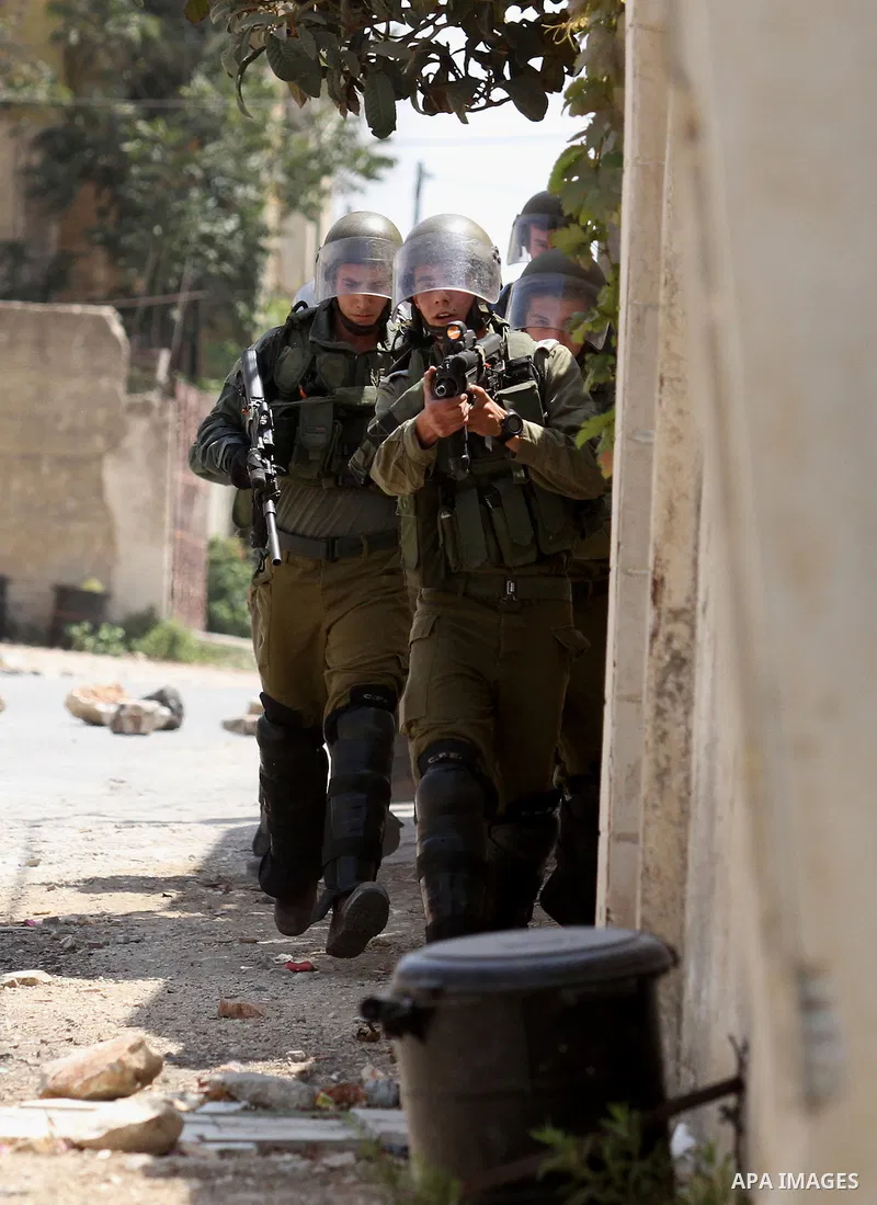 Israeli security forces take position during clashes with Palestinian protesters following a weekly demonstration against the expropriation of Palestinian land by Israel on August 26, 2016, in the village of Kfar Qaddum,...