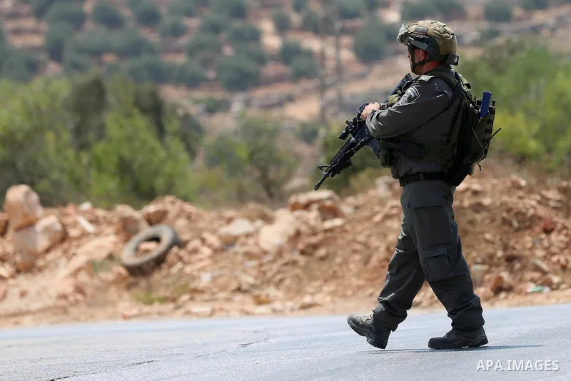 An Israeli border policeman stands guard at the scene where a Palestinian was shot and killed by Israeli forces in the West Bank village of Silwad near Ramallah August 26, 2016. Silwad, close to the Jewish settlement of...