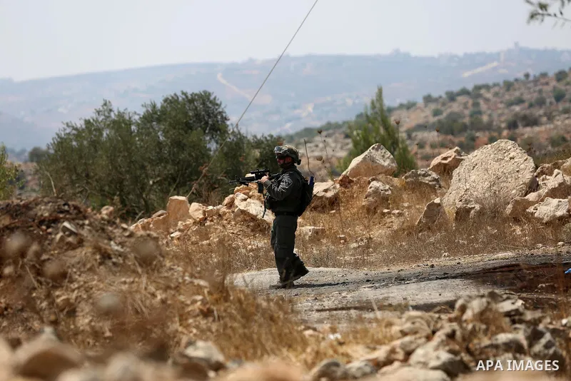 An Israeli border policeman stands guard at the scene where a Palestinian was shot and killed by Israeli forces in the West Bank village of Silwad near Ramallah August 26, 2016. Silwad, close to the Jewish settlement of...