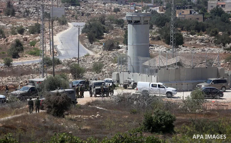 Israeli troops gather at the scene where a Palestinian was shot and killed by Israeli forces in the West Bank village of Silwad near Ramallah August 26, 2016. Silwad, close to the Jewish settlement of Ofra, is under cons...
