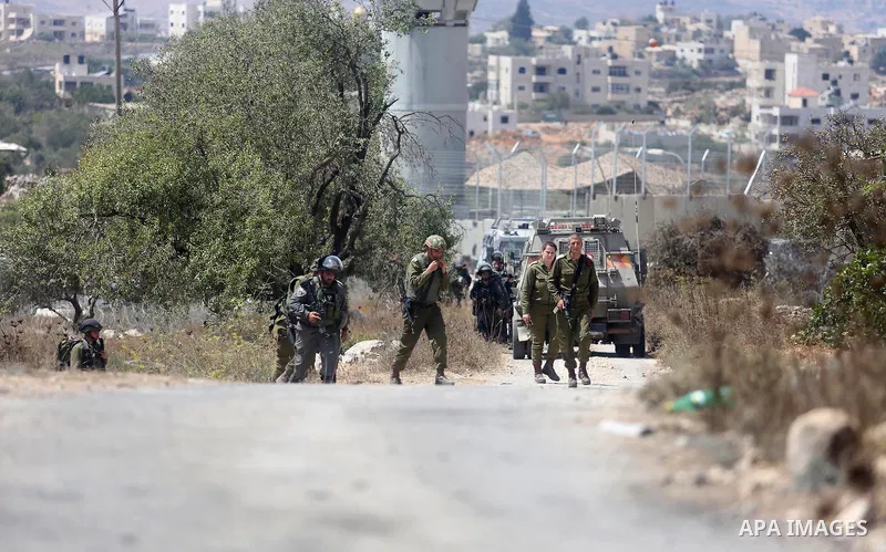 Israeli troops gather at the scene where a Palestinian was shot and killed by Israeli forces in the West Bank village of Silwad near Ramallah August 26, 2016. Silwad, close to the Jewish settlement of Ofra, is under cons...