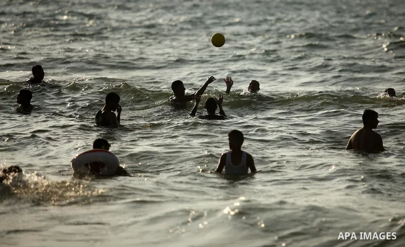 Palestinian children enjoy a day at the beach in Deir Al Balah in the center of Gaza strip at the last Friday of summer holiday, on Aug. 26, 2016. Photo by Ashraf Amra