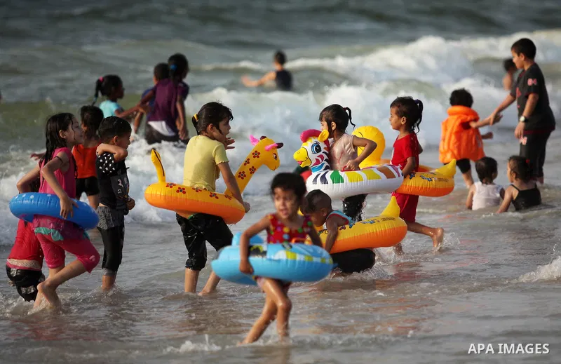 Palestinian children enjoy a day at the beach in Deir Al Balah in the center of Gaza strip at the last Friday of summer holiday, on Aug. 26, 2016. Photo by Ashraf Amra