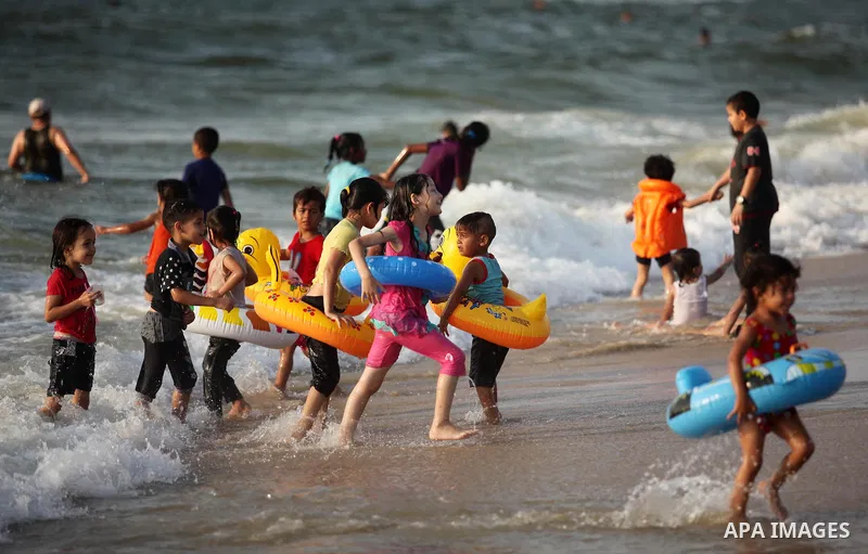 Palestinian children enjoy a day at the beach in Deir Al Balah in the center of Gaza strip at the last Friday of summer holiday, on Aug. 26, 2016. Photo by Ashraf Amra