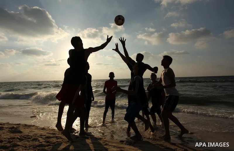 Palestinian children enjoy a day at the beach in Deir Al Balah in the center of Gaza strip at the last Friday of summer holiday, on Aug. 26, 2016. Photo by Ashraf Amra
