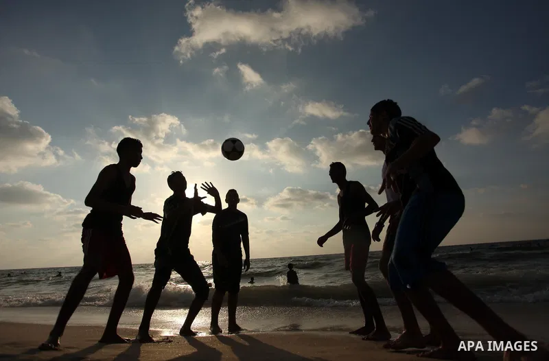 Palestinian children enjoy a day at the beach in Deir Al Balah in the center of Gaza strip at the last Friday of summer holiday, on Aug. 26, 2016. Photo by Ashraf Amra