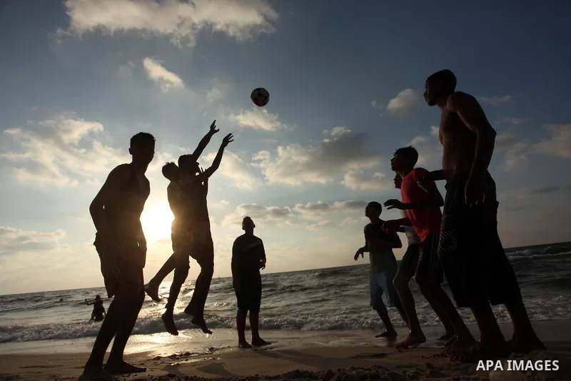 Palestinian children enjoy a day at the beach in Deir Al Balah in the center of Gaza strip at the last Friday of summer holiday, on Aug. 26, 2016. Photo by Ashraf Amra